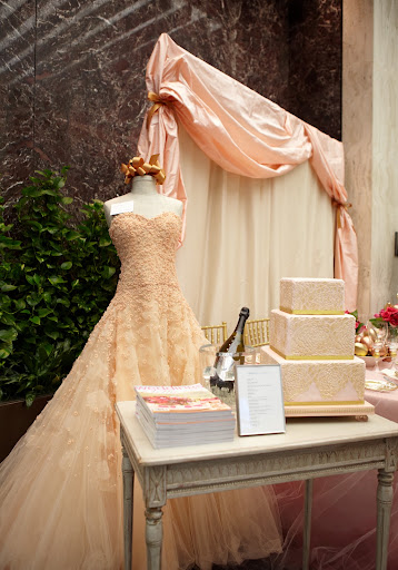 This beautiful gown is by Peter Langner. Also featured, Dom Perignon's Wedding Champagne, and a pink and gold cake featured in the pages of Martha Stewart Weddings.