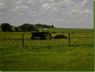 Paul cutting hay in our field