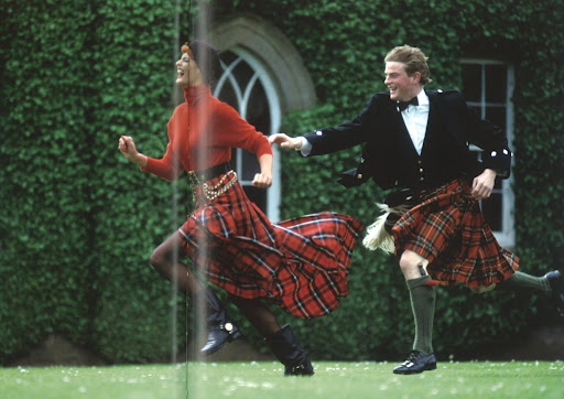 Skirt-chasing -- a rush of tartan pleats. Photo by Arthur Elgort/Vogue1991.