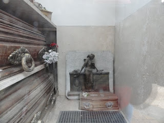 Looking in the glass door. Very small casket for a very short life.