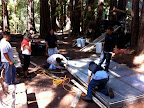 Installing the reclaimed wood stage.