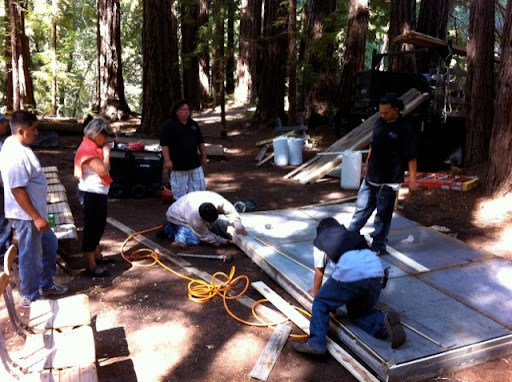 Installing the reclaimed wood stage.
