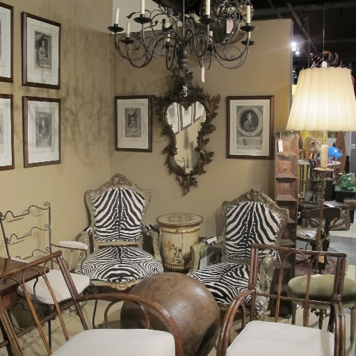 I like the use of zebra hide for the backing of those antique chairs.