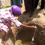 Dipping water out of a hand dug well