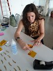 And Colleen making the garlands. We used tape dispensers to keep the monofilament taut.