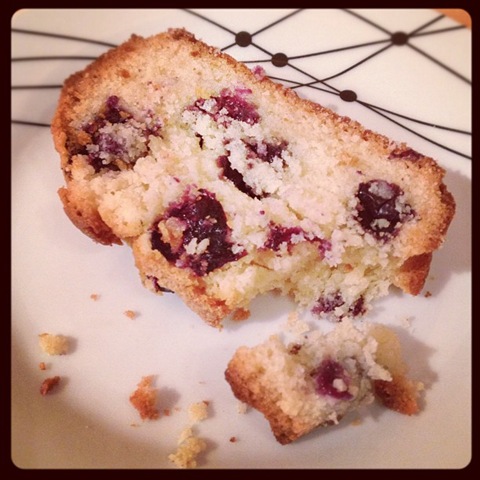 Taking a bite of blueberry loaf cake
