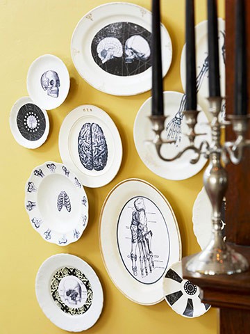 A cluster of macabre plates makes a statement on a tinted wall. (www.pinterest.com) A cluster of macabre plates makes a statement on a tinted wall. (www.pinterest.com)