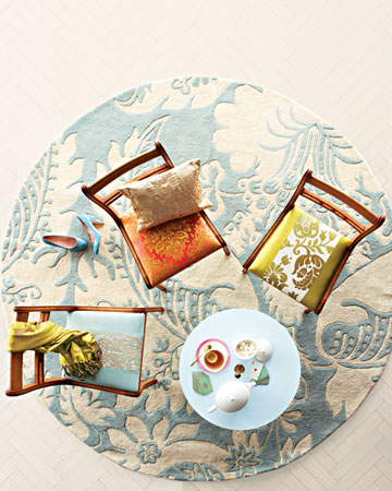 This round rug anchors a cluster of damask-upholstered chairs. Show off the pattern in a surprising, modern way by covering some seats entirely with a damask fabric and others with just a stripe of it. This round rug anchors a cluster of damask-upholstered chairs. Show off the pattern in a surprising, modern way by covering some seats entirely with a damask fabric and others with just a stripe of it.