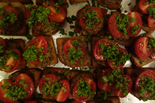 Crostinis with tomato, mushrooms, and fresh herbs.