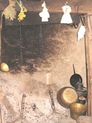 Plimoth Plant fireplace w herbs and pots