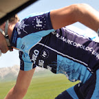 Jan Kuijckx gets some bidons for his teammates from the Marco Polo Cycling Team at the Tour of Qinghai Lake. (photo: Remko Kramer)