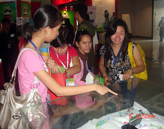 Students browse latest digital cameras.