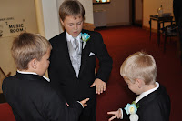Playing rock, paper, scissors to pass the time as they wait to walk down the isle.