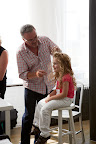 One of our darling flower girls getting her hair done