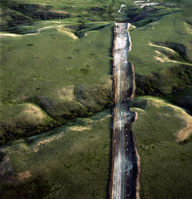 Aerial view of an oil pipeline cutting through the prairie near White Earth, North Dakota. Photo: Terry Evans
