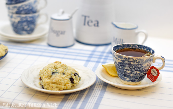 Eat a blueberry scone for breakfast or serve as a blueberry dessert. A melt in your mouth recipe for blueberry scones. Inspired by Starbucks in house version, this blueberry scone with hints of lemon and a crunchy sugary top will delight everyone. Serve during High Tea, or just as a mid afternoon snack. Perfect along side tea or coffee, or as a stand alone blueberry dessert. You won't believe how easy these are to make! Never made scones before? Never fear, this includes a step by step tutorial on how to make scones. #HighTea #blueberries #Starbucks #scones #dessert #DowntonAbbey Eat a blueberry scone for breakfast or serve as a blueberry dessert