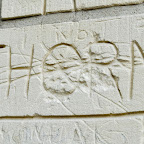 The brick wall behind the church is carved with names. Here's one carved with the name of the town DSC_6603.jpg