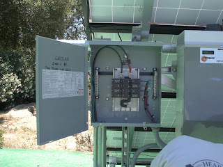 This is the A/C combiner box. Inverters from both racks are fed into here. As you can see, wiring from this rack only has been attached. Wiring from inverters are connected to the 2/P breakers and backfed. Wiring from the other rack will be pulled in shortly.