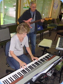 Denise Gunson playing Peter Brophy's Korg SP-250 digital piano with husband, Brian, accompanying on guitar.