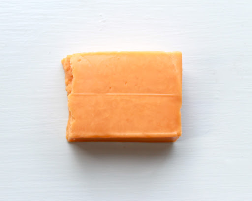 A brick of Kraft cheddar cheese