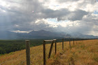 Barbed-wire fence and foothills