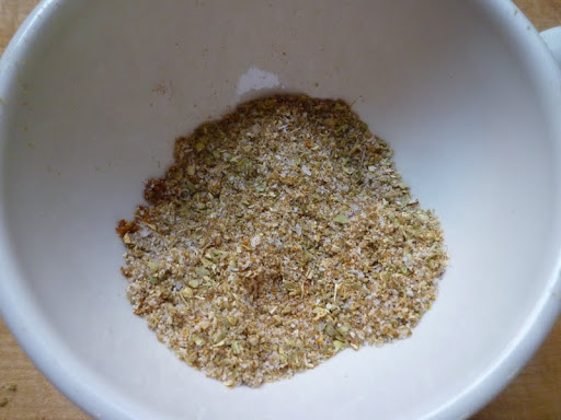 Spice rub for pork-cumin, coriander, oregano, paprika, coarse salt, and sugar.