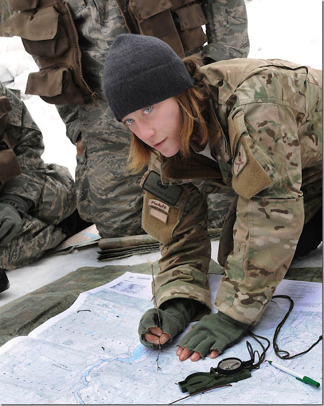  Senior Airman Charlene Plante, 22nd Training Squadron, Survival Evasion Resistance Escape specialist, teaches her students triangulation March 13, 2011 in Colville National Forest, Wash., The purpose of this block of training is to teach students how to pinpoint their location using a map, compass and sticks. (U.S. Air Force Photo/Tech. Sgt. JT May III)