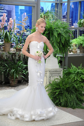 This ruched tulle strapless mermaid gown with satin ribbon trim is so sweet.