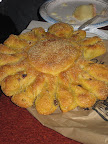 Sunflower-shaped semolina-raisin fennel bread - with a cornmeal crust.