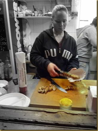 Currywurst being created. Image slightly fuzzy due to camera being held by inebriated man