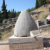 In Delphi: the navel of the earth!
