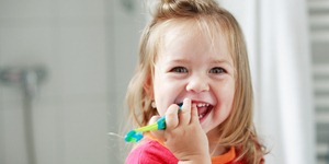 Small girl washing her teeth Small girl washing her teeth