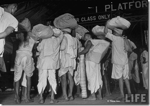 People waiting in railroad station trying to escape city after bloody rioting between Hindus and Muslims3