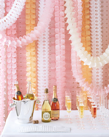 Hang colorful streamers en masse, and you've got a chic way to decorate a champagne bar -- or any focal point that needs more oomph. (marthastewartweddings.com)