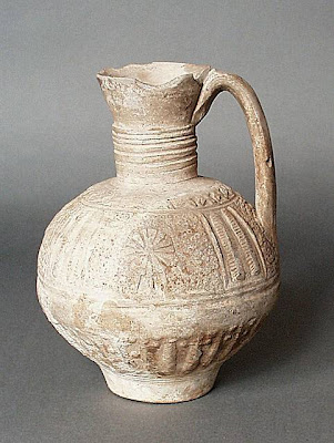 Ewer Greater Iran (Afghanistan) Ewer, 12th-14th century Ceramic; Vessel, Fritware, unglazed, molded, Height: 8 5/16 in. (21 cm); Diameter: 5 9/16 in. (14 cm) Gift of Kate Fitz Gibbon and Andrew Hale (AC1997.253.2) Art of the Middle East: Islamic Department.
