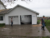 The garage door has been blown in on the house Lowell Unruh's turkey farm in the 1100 block of Franklin Avenue in Henry County The garage door has been blown in on the house Lowell Unruh's turkey farm in the 1100 block of Franklin Avenue in Henry County