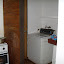 Along side the kitchen, the laundry room. Door goes to an outside area to dry clothes.