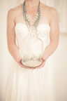 Glass jugs filled with sand and air plants decorated the space. Glass jugs filled with sand and air plants decorated the space.