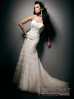 The layered lace on this Tony Bowls gown creates soft, elegant lines. The layered lace on this Tony Bowls gown creates soft, elegant lines.