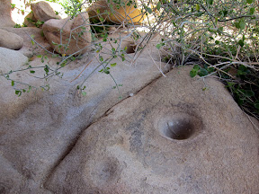 Morteros at the mouth of the pictograph cave in Carrizo Gorge
