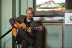 David McLean treats guests to flamenco guitar music.
Photo by Eric Slomanson/slomophotos.com - Copyright 2010.