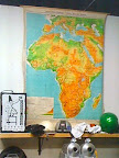 Reclaimed classroom maps hung in the roasteria show top coffee-growing regions. Reclaimed classroom maps hung in the roasteria show top coffee-growing regions.