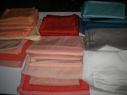 Our fabrics, arranged in color order on our shoot.