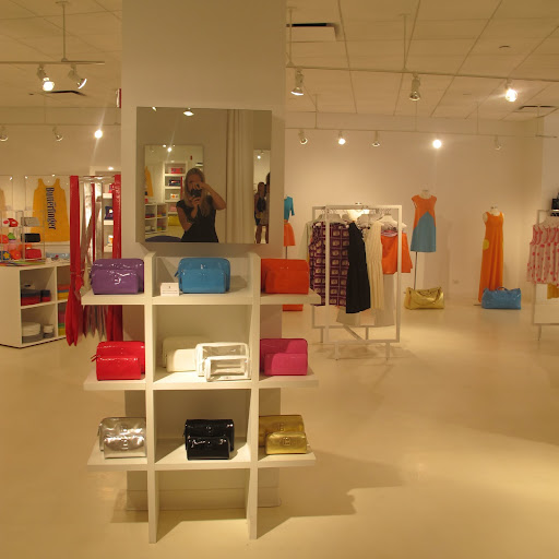 Lisa Perry makes a great range of handbags and purses and they come in bright, patent materials.