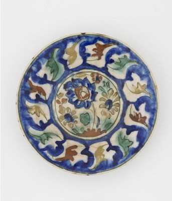 Plate | Origin:  Possibly Tabriz,  Iran | Period: late 16th-early 17th century  Safavid period | Details:  Not Available | Type: Stone-paste painted under colorless glaze | Size: W: 6.8  cm | Museum Code: S1997.55 | Photograph and description taken from Freer and the Sackler (Smithsonian) Museums.