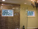 Insulated leaded beveled diamond window in a shower.