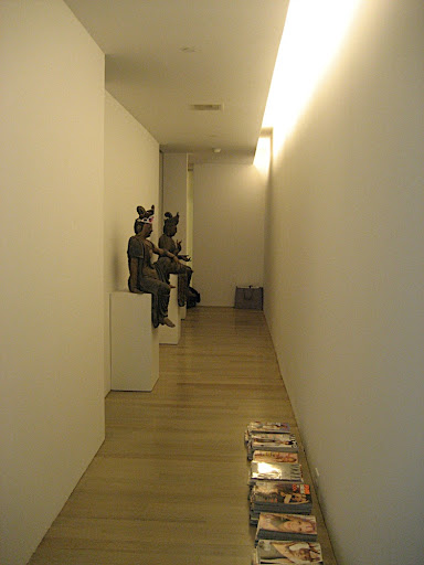 I have been thinking about installing a mirror at the end of the hallway and possibly on the wall behind the two figures.