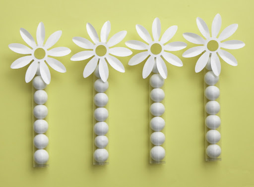 Tubes of gum balls accented with the paper daisy flower makes a great favor. Tubes and paper daisies sold separately. Tubes of gum balls accented with the paper daisy flower makes a great favor. Tubes and paper daisies sold separately.