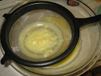 Pour the mixture through a fine mesh sieve or strainer into a heat proof bowl.