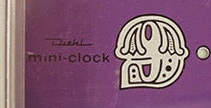Diehl Mini clock battery operated alarm clock purple face model imprint and supergraphic 9